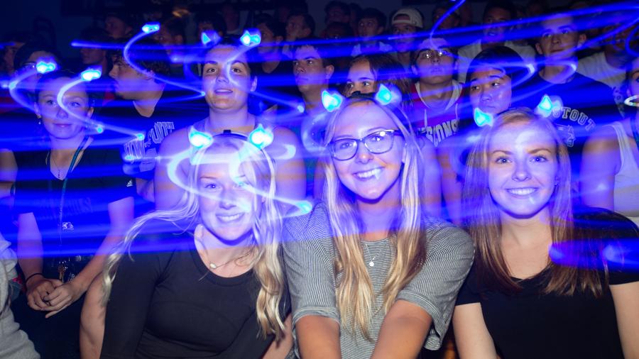 Blue lights swirl around students Sept. 1 during the Blue Rah celebration at UW-Stout to welcome first-year students to campus.