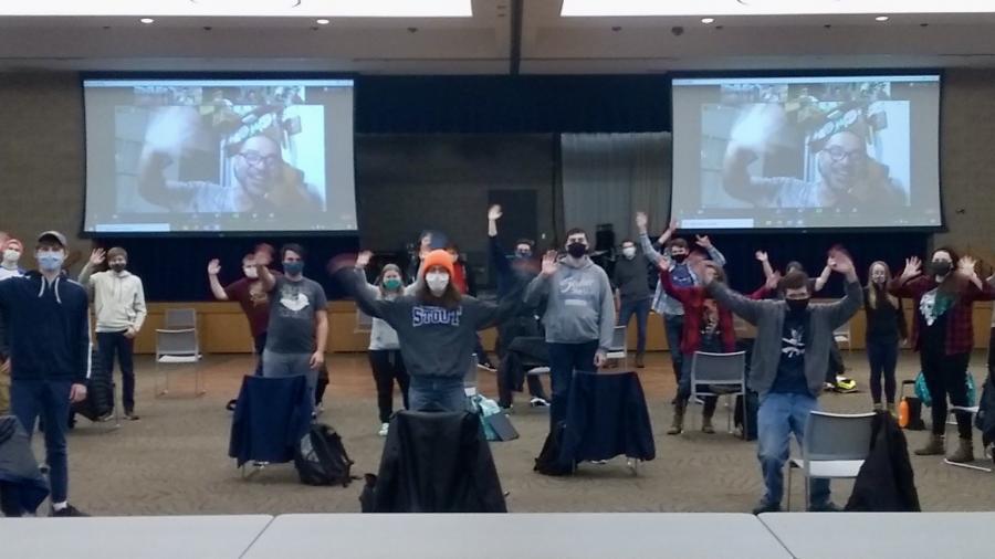 The choir performs for the video in the Memorial Student Center.