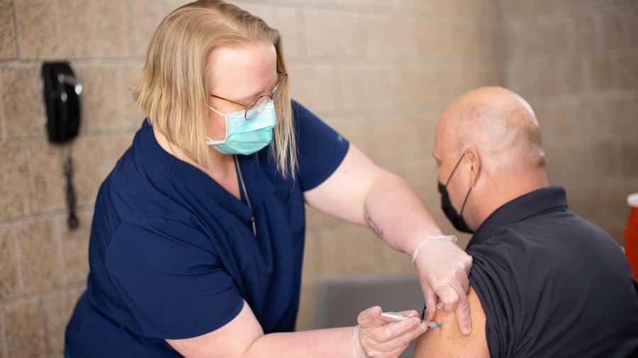 UW-Stout employee Zenon Smolarek is vaccinated against COVID-19 during a recent pop-up clinic on campus.