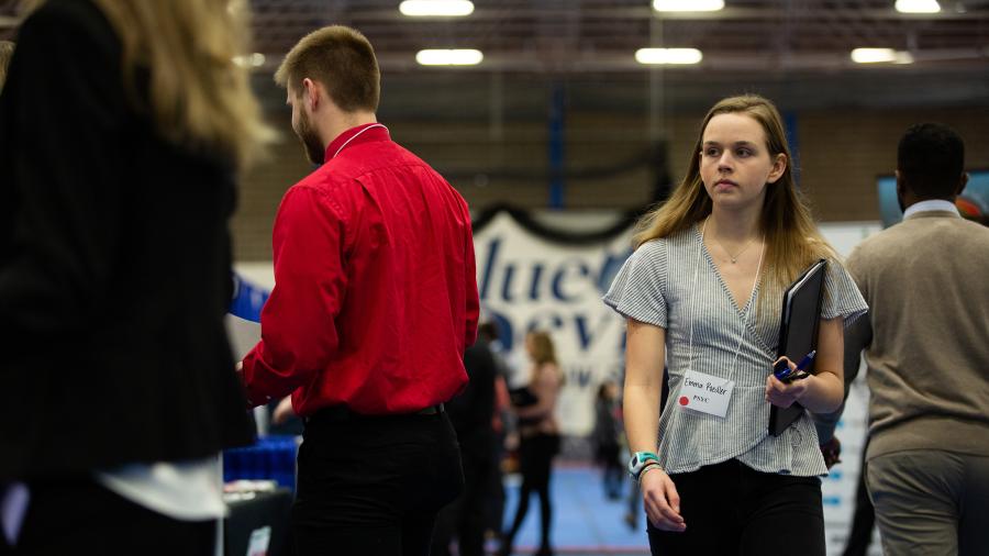 Students walk through the 2020 Spring Career Conference, held before the COVID-19 pandemic.