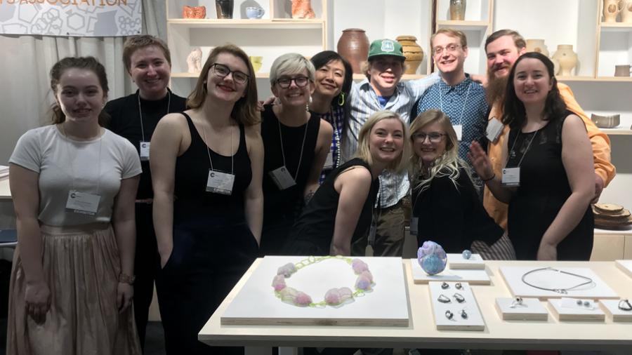 UW-Stout art students, along with Associate Professor Masako Onodera, fifth from left, displayed their handmade ceramics and jewelry.