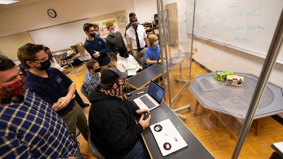 During the competition, students encourage each other and laugh as their bots lost, or lose parts. 