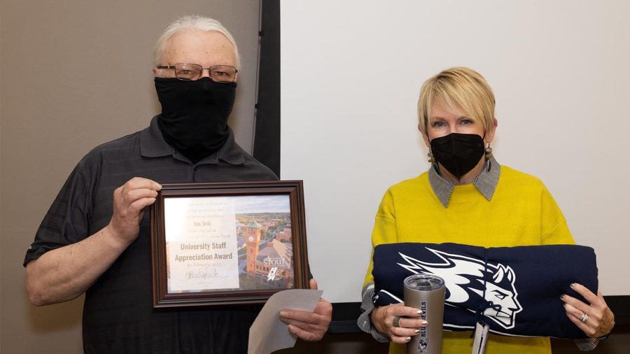Jim Selz receives the February University Staff Appreciation Award from Chancellor Katherine Frank.