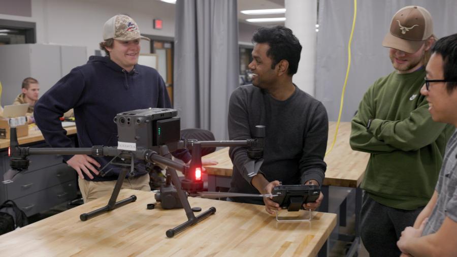 Assistant Professor Abhi Verma helps students assemble drones in an engineering technology class at UW-Stout.