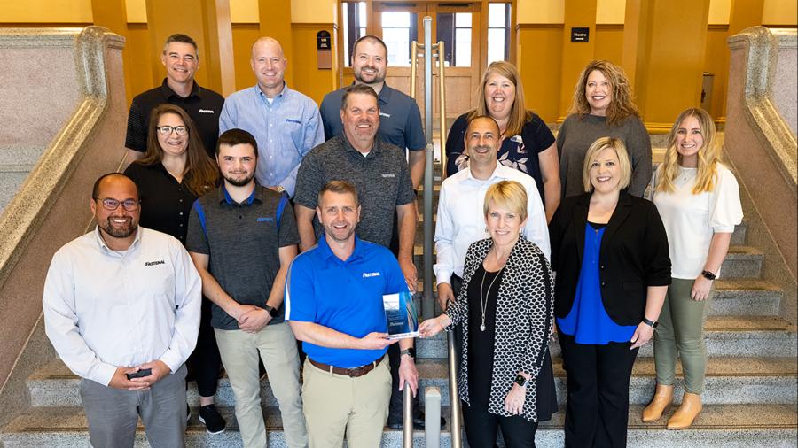 Chancellor Katherine Frank presents the UW-Stout Career Services 2022 Employer of the Year award to Justin Oleson, general manager of the Fastenal in Menomonie. Seven Fastenal representatives toured campus and met with UW-Stout officials and professors as part of the award event.