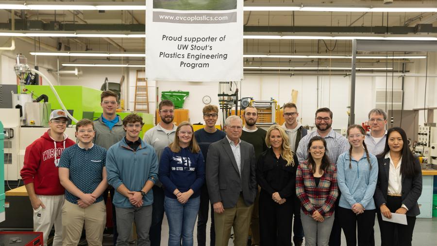 Dale Evans and Anna Evans Bartz, front row center, of EVCO Plastics meet with students in UW-Stout’s plastics engineering lab after donating $100,000 to support projects that improve sustainability within the industry.