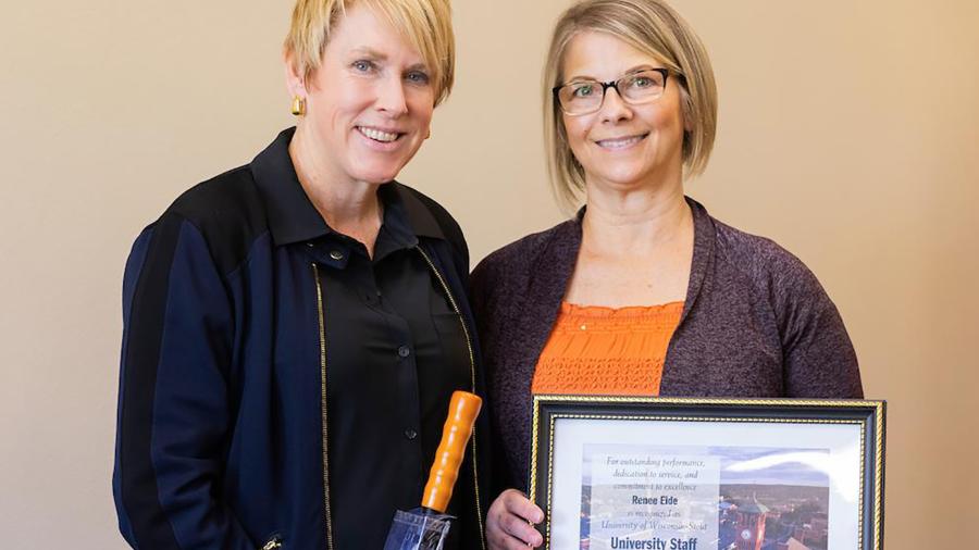 Renee Eide, right, receives the September University Staff Employee Appreciation Award from Chancellor Katherine Frank.