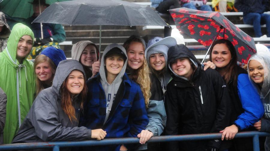 Students at a Blue Devils football game.