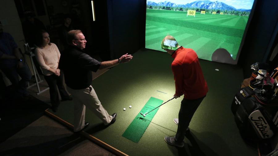 A golf simulator on campus is used for the Fitting and Swing Analysis class in the GEM program.