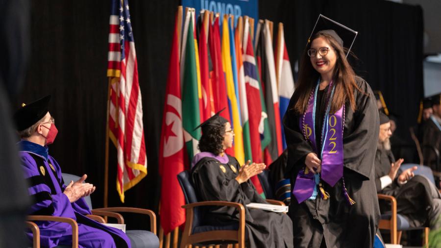 Jade Krol crosses the commencement stage on Dec. 17.