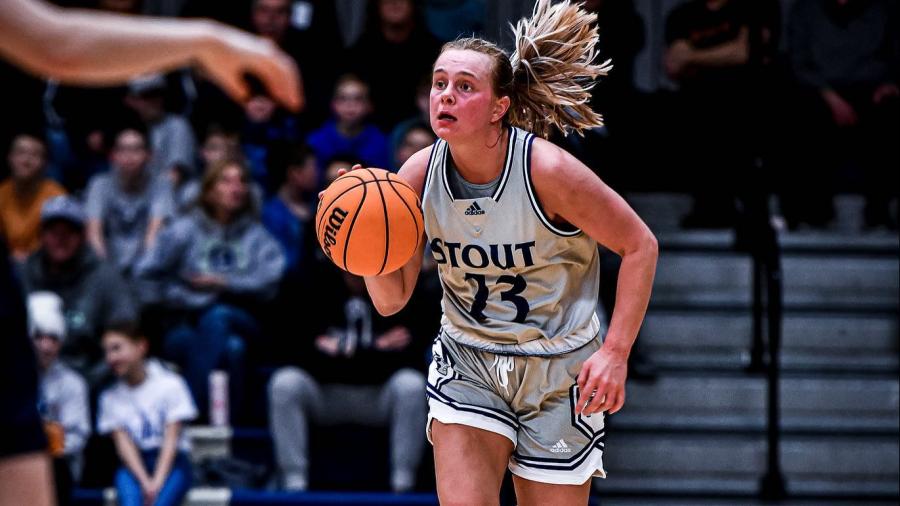 Anna Mutch dribbles up the court during the UW-Eau Claire game.