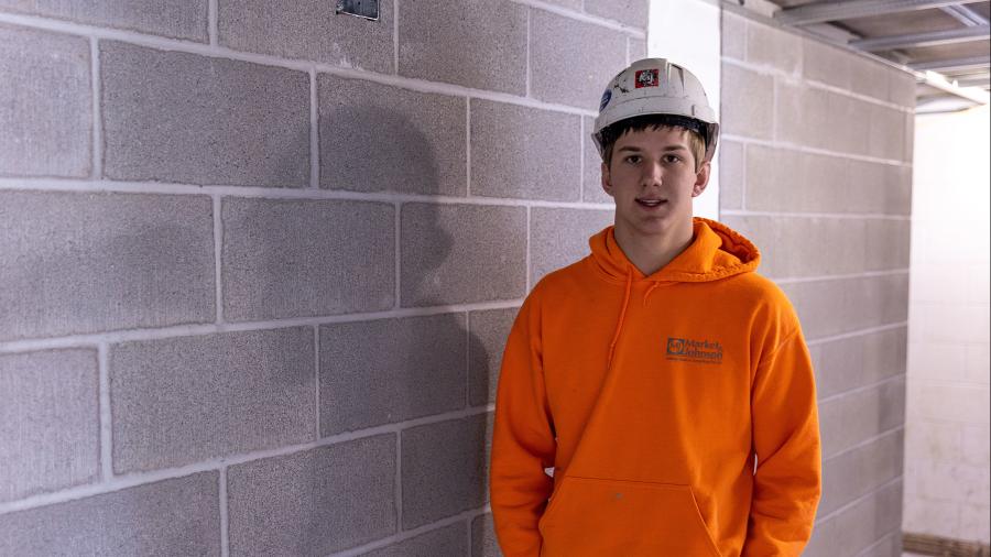 Tommy Quinn, a first-year construction major at UW-Stout, is helping build interior cement block walls at South Hall.