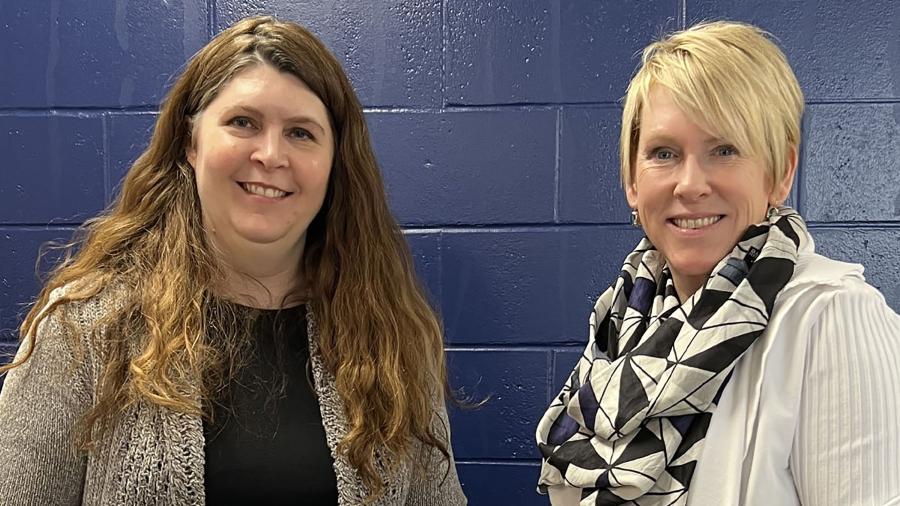 Beth Biederman, left, receives the February University Staff Employee Appreciation award from Chancellor Katherine Frank.