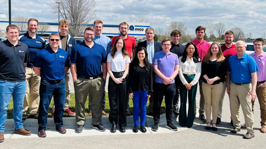 Plastics engineering students and faculty gather with EVCO officials, including founder, chairman and CEO Dale Evans, second from right, at EVCO headquarters in DeForest.