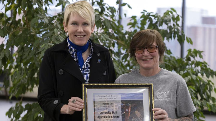 Melissa Koss, right, receives the April University Staff Employee Appreciation award from Chancellor Katherine Frank.