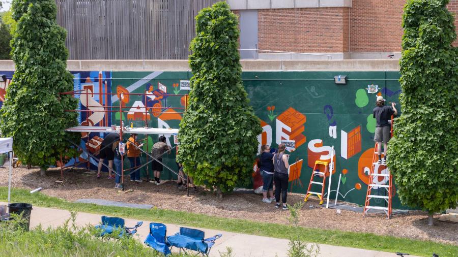 A wide shot of the entire mural while still in progress.