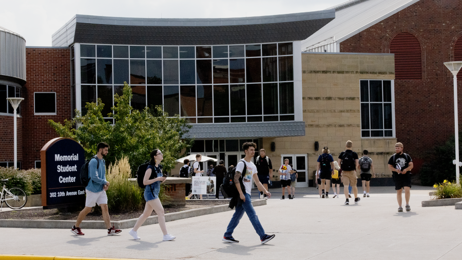Students pass by the Memorial Student Center at UW-Stout.