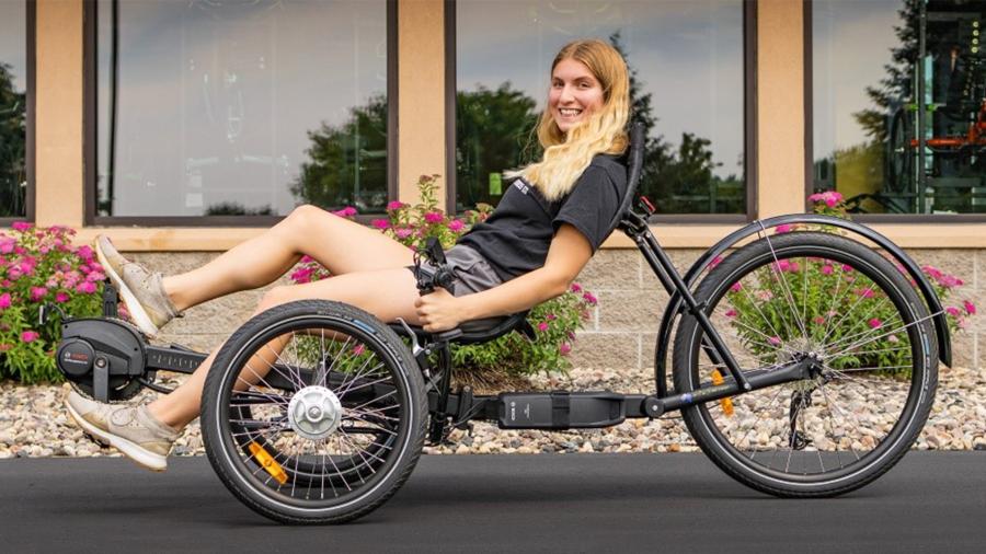 MBE student Mikayla Obsuszt on a bike at the Hostel Shoppe
