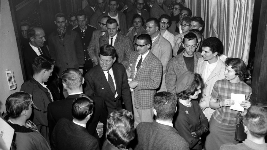 John F. Kennedy greets students during his 1960 visit to UW-Stout. Jackie Kennedy is at lower right.