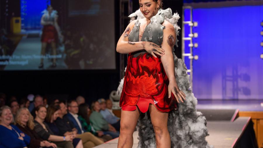 Student modeling on the runway at Fashion Without Fabric