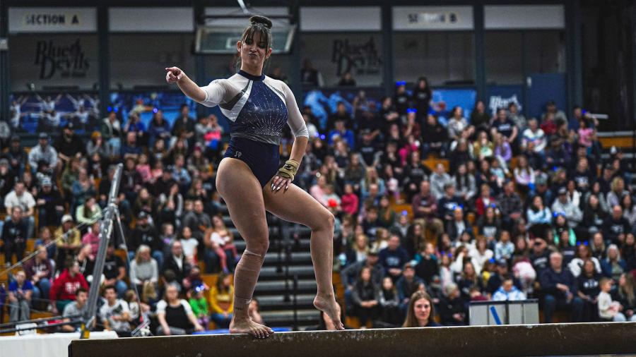 Inspiring grad Genevieve Czaplewski on the balance beam