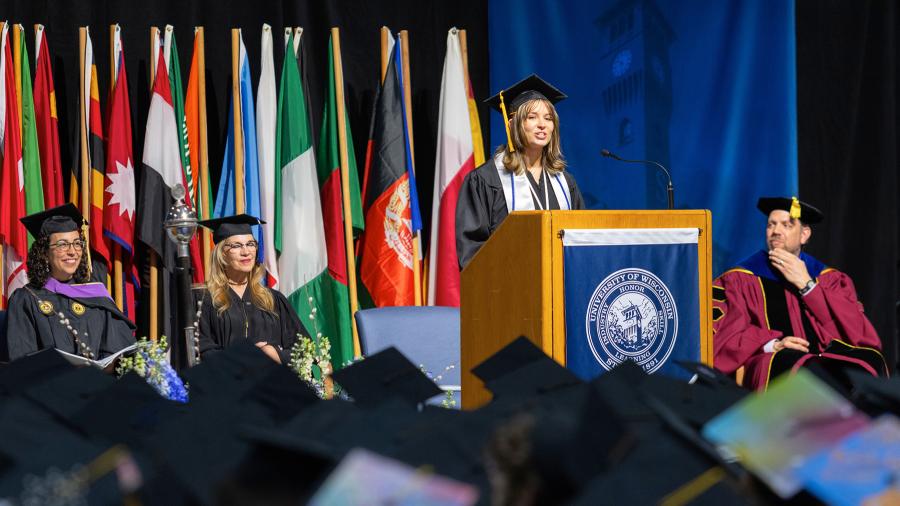 Graduate Genevieve Czaplewski speaks during one of the two undergraduate ceremonies.