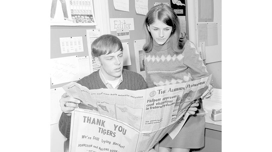 Stoutonia student newspaper co-editors Bruce Tietz and Lori Malzahn check a newspaper in 1970.