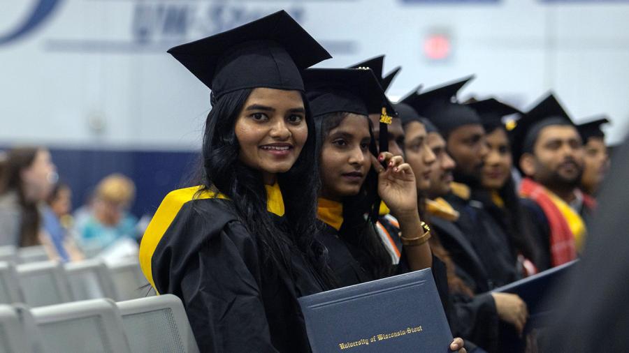 Meghana Maske holds her newly received UW-Stout diploma.