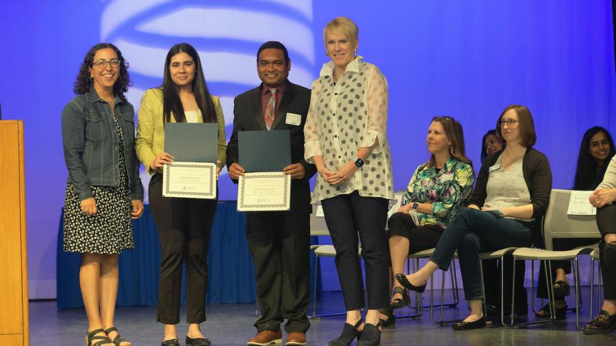 Mridini Upadhyay, second from left, and Associated Professor Pranabendu Mitra, second from right, receive Research Day awards.