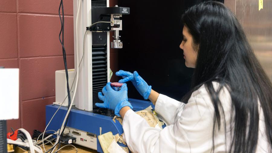 Mridini Upadhyay works with equipment in a UW-Stout lab.