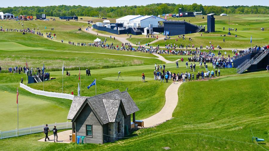 Clusters of people on a golf course