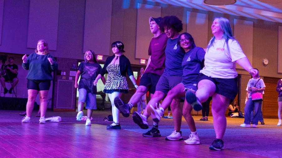 Students dance at an involvement fair