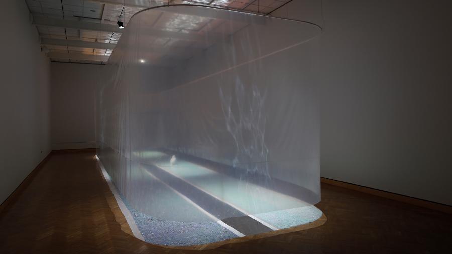 An art installation featuring light and plastic sheets mimicking a lagoon