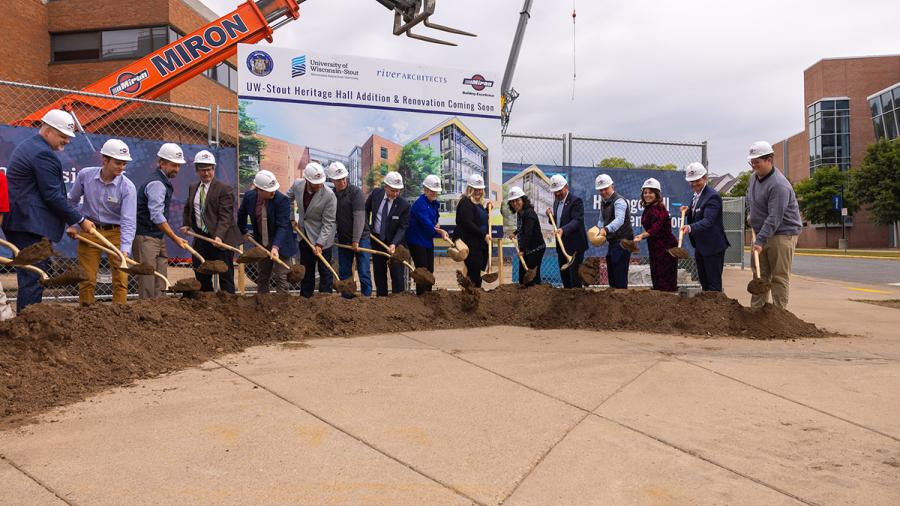 Large group with hard hats and shovels