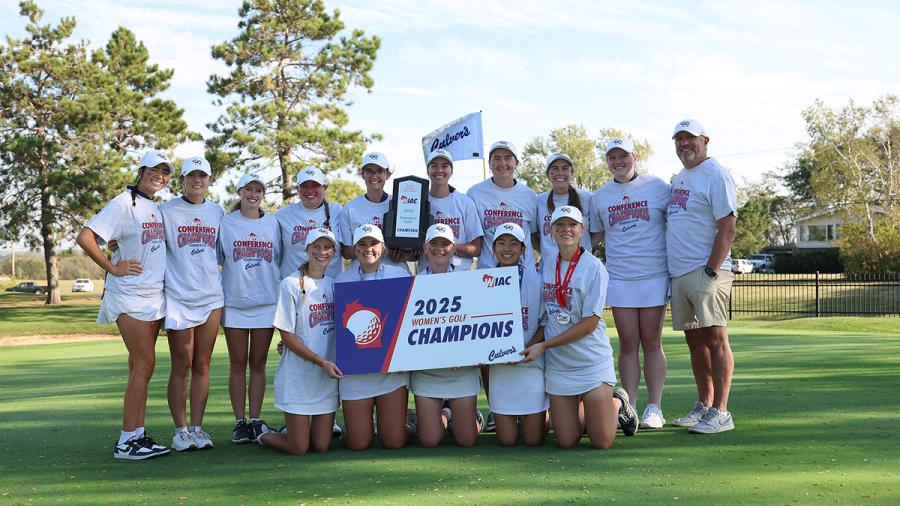 Golf team with trophy