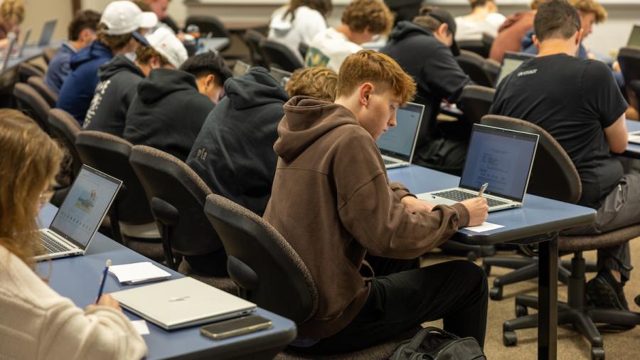 Students writing in a composition course