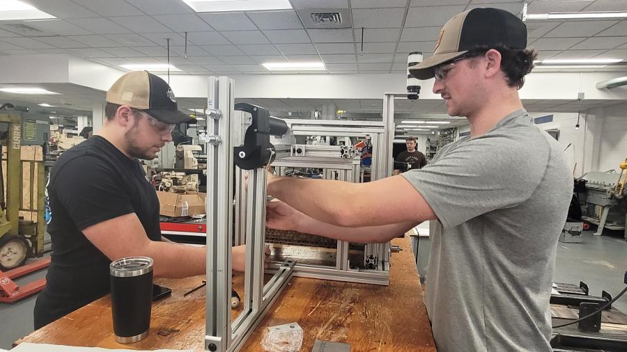 Chase Rodewald and Riley Stiehl assemble a pallet stacker prototype