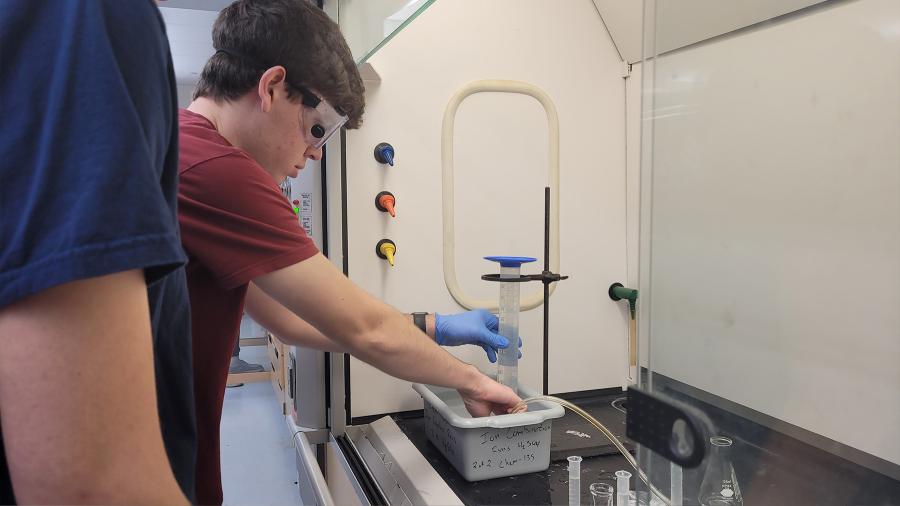 Honors chemistry students conduct a hydrogen experiment