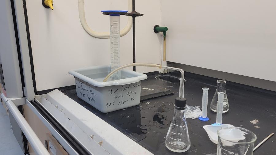 Honors chemistry students conduct a hydrogen experiment