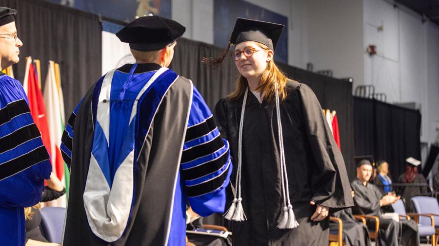 Woman receives diploma