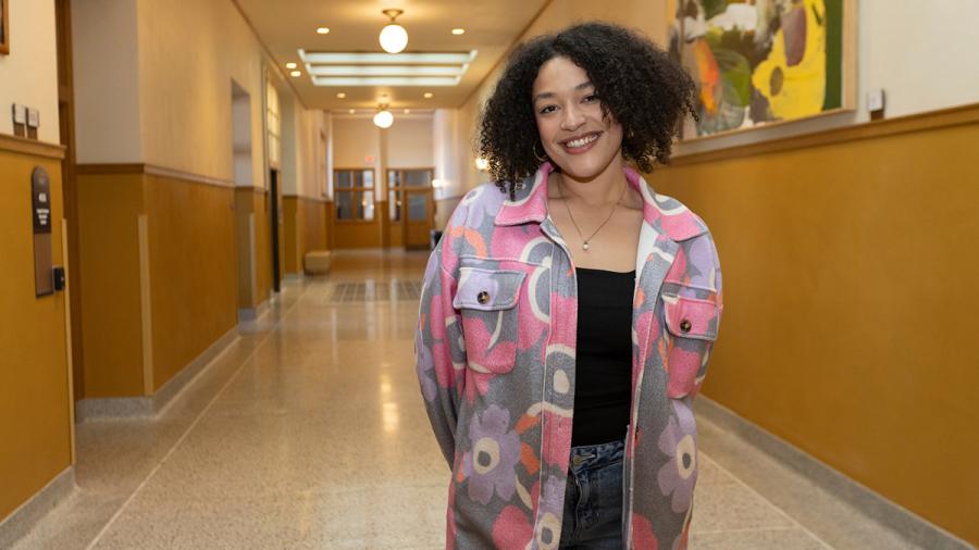 Woman in hallway of college building
