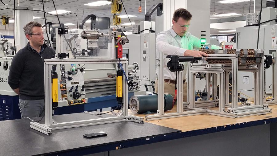 Zachary Morgan and Luke Mertens present the pallet stacker prototype