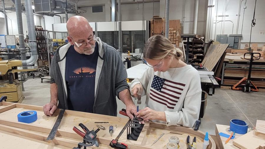 An industrial design student and lab director work together in the Process Lab.