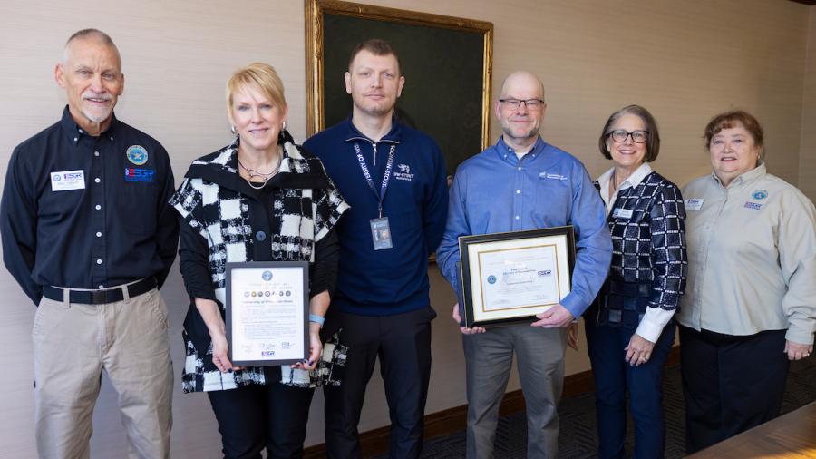 Mike Hallquist, Chancellor Katherine Frank, Tech. Sgt. Jeremy Nelson, Deputy CIO Tom Janicki, CIO Sue Traxler and Martha Stratton