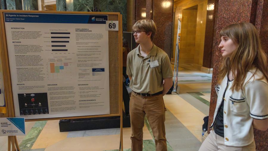 Two students and research presentation