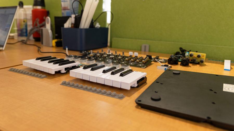 The 3D-printed components, including the keyboard, of a music creating machine.
