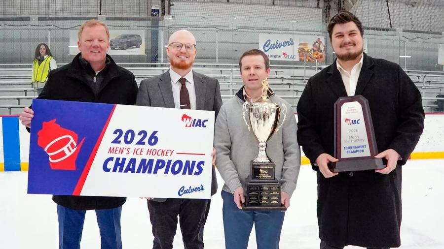 Coaches with hockey trophy