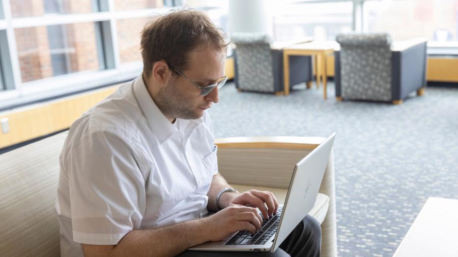 Man typing on laptop