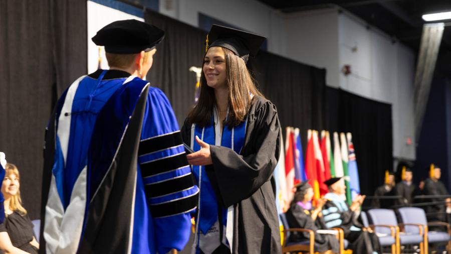 Woman receiving diploma