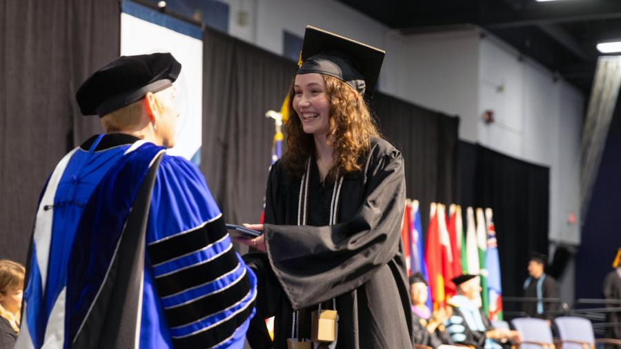 Woman receiving diploma
